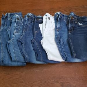 Seven pairs of various styles of denim